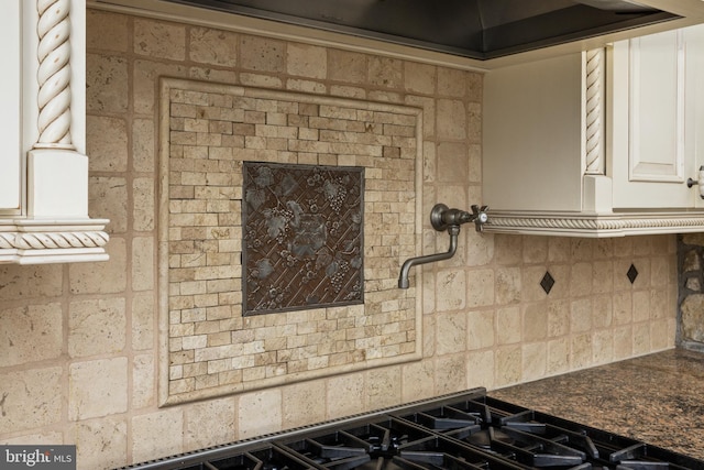 room details with white cabinetry and backsplash