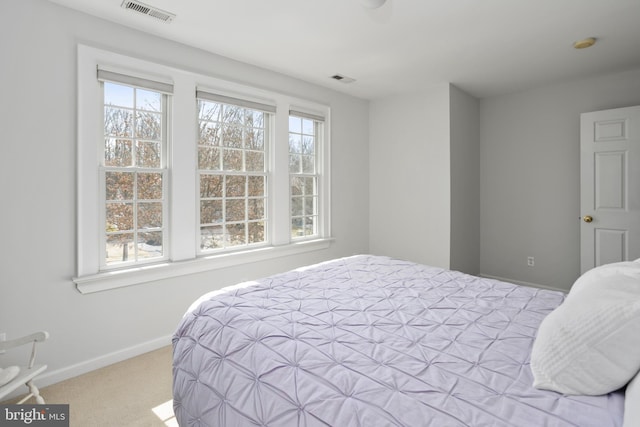 bedroom featuring carpet, visible vents, and baseboards