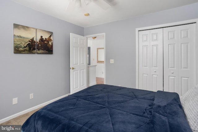 bedroom with a closet, baseboards, a ceiling fan, and carpet flooring