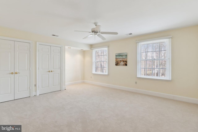 unfurnished bedroom with visible vents, baseboards, and carpet floors