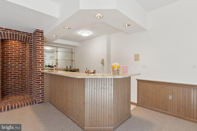 bar featuring wet bar and light carpet