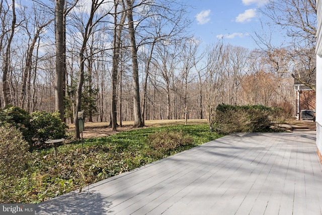 deck featuring a forest view