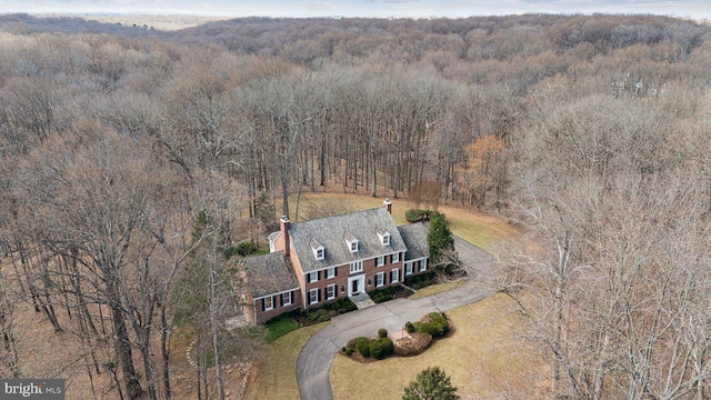 bird's eye view featuring a forest view