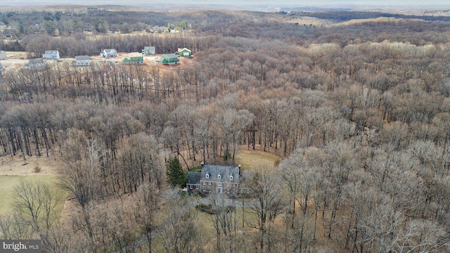 bird's eye view with a rural view and a wooded view