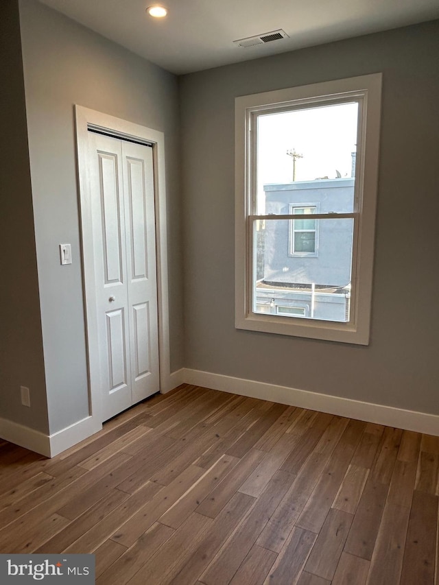 2869 Aramingo Ave, Philadelphia, PA 19134 - unfurnished bedroom featuring visible vents, baseboards, and wood finished floors