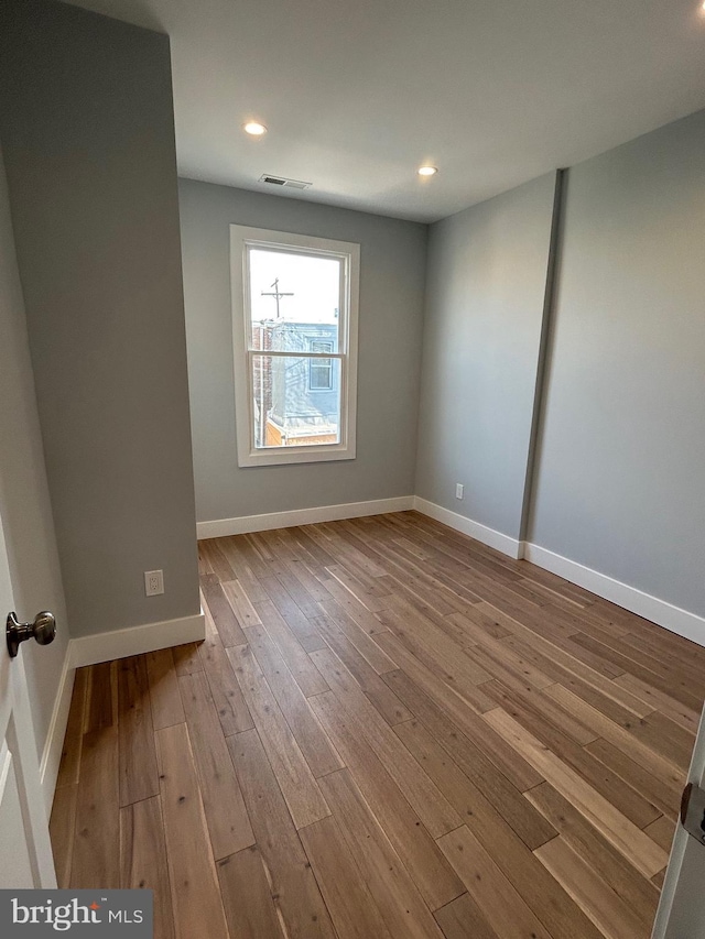 2869 Aramingo Ave, Philadelphia, PA 19134 - empty room featuring recessed lighting, visible vents, baseboards, and wood finished floors