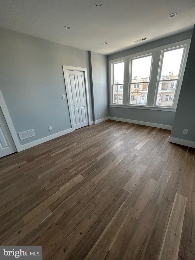 2869 Aramingo Ave, Philadelphia, PA 19134 - empty room featuring recessed lighting, visible vents, baseboards, and dark wood finished floors