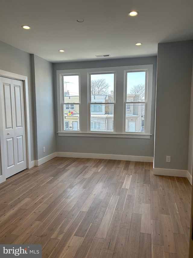 2869 Aramingo Ave, Philadelphia, PA 19134 - unfurnished room featuring a wealth of natural light, visible vents, wood finished floors, and recessed lighting