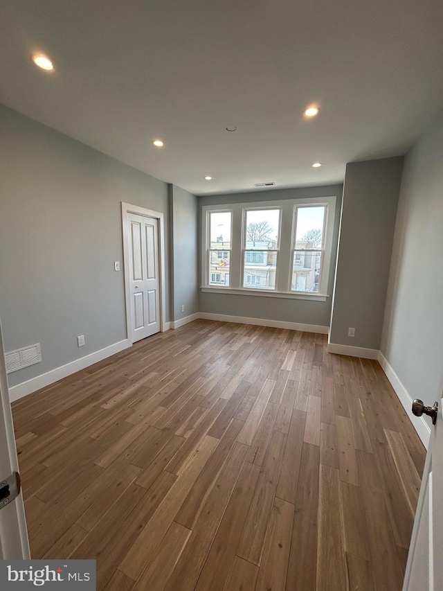2869 Aramingo Ave, Philadelphia, PA 19134 - empty room featuring visible vents, recessed lighting, wood finished floors, and baseboards