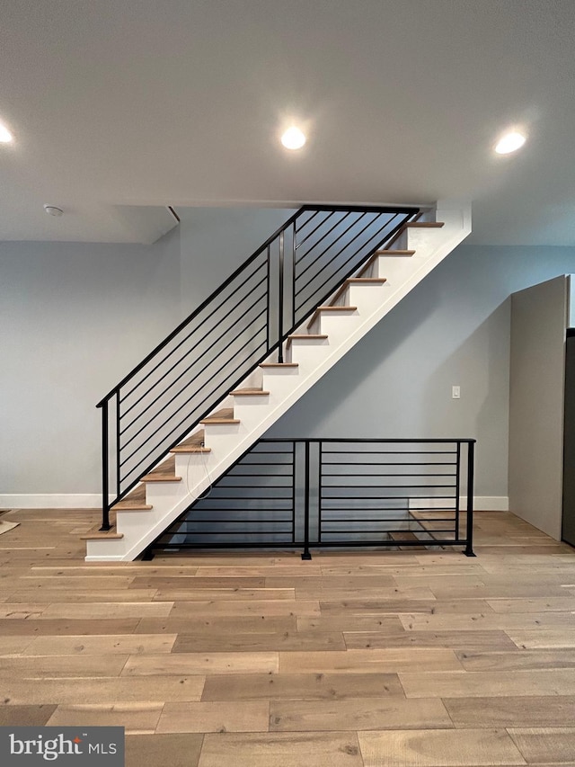 2869 Aramingo Ave, Philadelphia, PA 19134 - staircase featuring recessed lighting, baseboards, and hardwood / wood-style floors