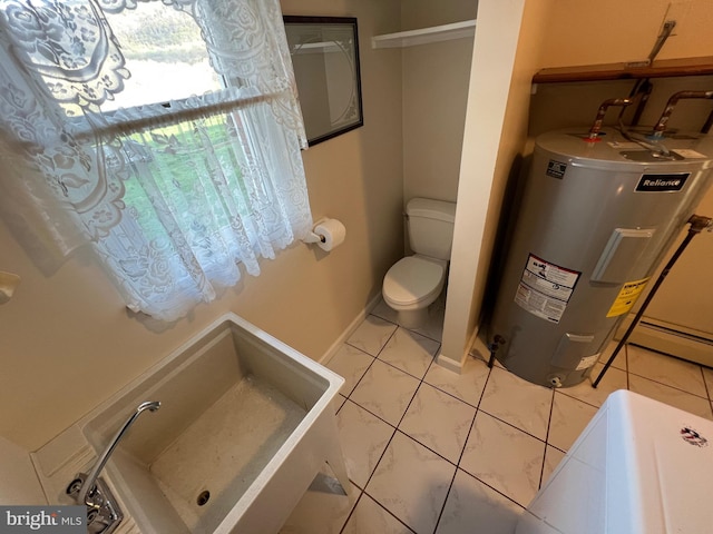 bathroom with electric water heater, tile patterned flooring, and toilet