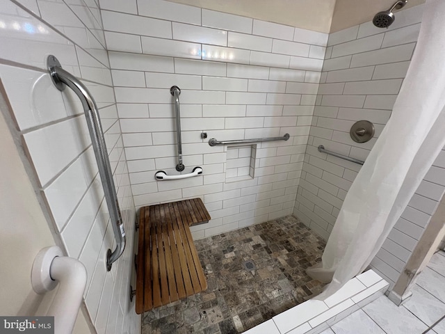 bathroom featuring a shower stall