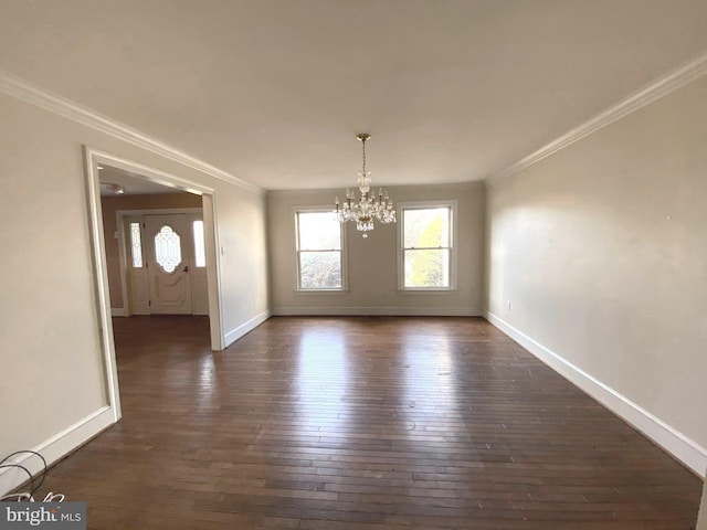 unfurnished dining area featuring a notable chandelier, crown molding, dark wood-type flooring, and baseboards