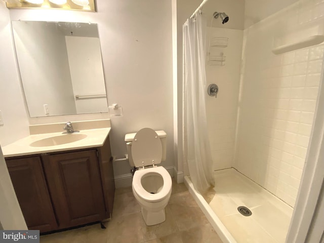 full bath with tile patterned floors, toilet, a shower stall, and vanity