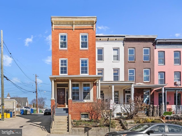 view of property featuring brick siding