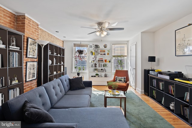 living room with ceiling fan and wood finished floors