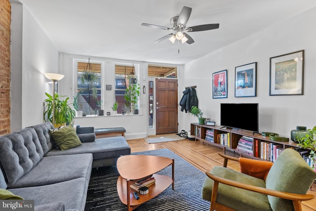 living room with parquet flooring and ceiling fan