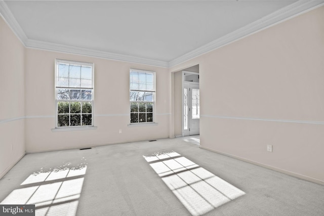 unfurnished room featuring baseboards, carpet floors, and ornamental molding