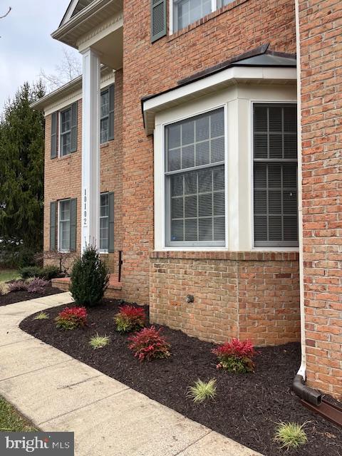 view of side of home featuring brick siding