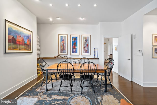 dining room with recessed lighting, baseboards, and wood finished floors