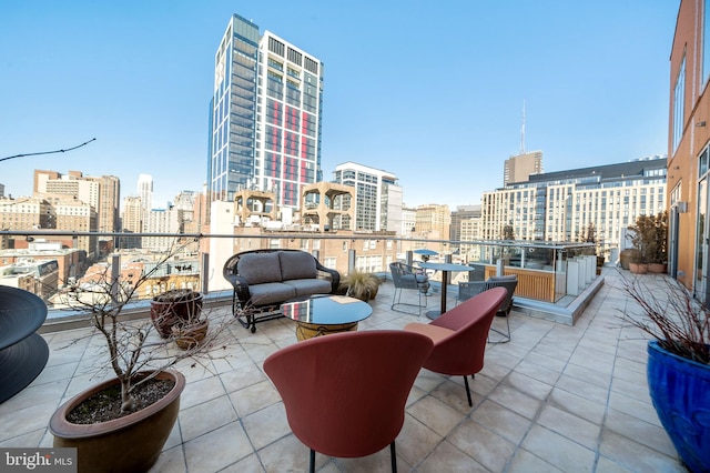 view of patio / terrace featuring a city view and a balcony