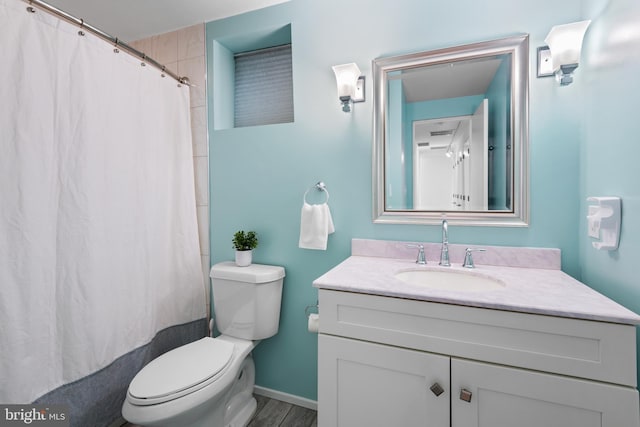 full bath with vanity, toilet, baseboards, curtained shower, and wood finished floors
