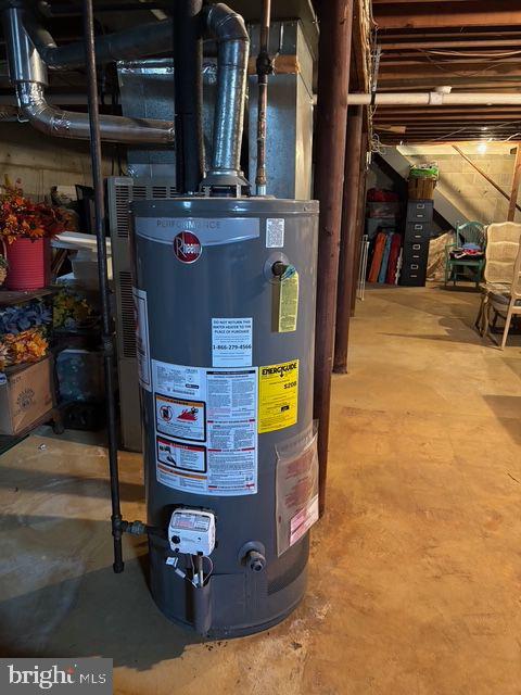 utility room featuring gas water heater