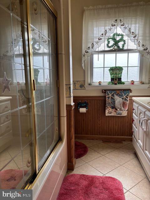 full bathroom with vanity, tile patterned floors, and an enclosed shower