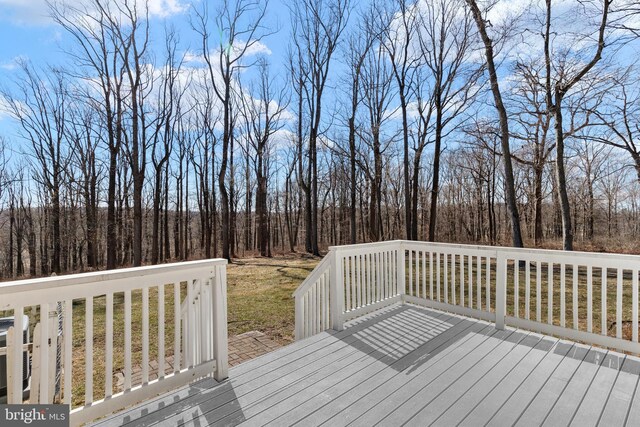 deck featuring a wooded view