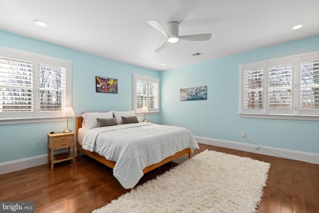 bedroom featuring visible vents, recessed lighting, baseboards, and wood finished floors