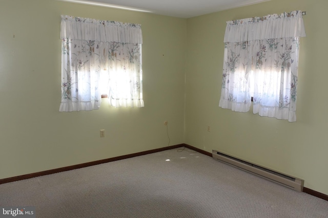 unfurnished room featuring a baseboard radiator, baseboards, a healthy amount of sunlight, and carpet flooring