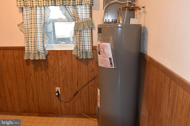 utility room with electric water heater