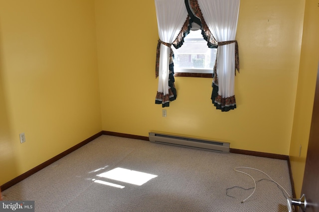 empty room featuring carpet flooring, baseboards, and baseboard heating