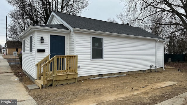 view of front of property with a shingled roof