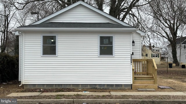 view of home's exterior featuring a shingled roof