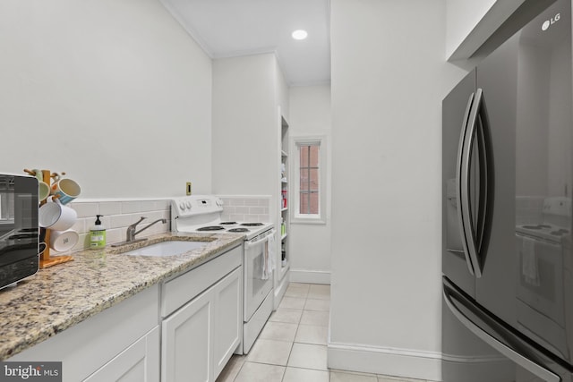 kitchen with a sink, electric range, backsplash, and stainless steel refrigerator with ice dispenser