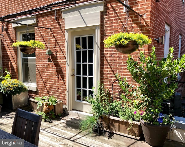 entrance to property with brick siding