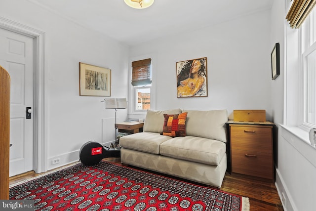 living area with dark wood finished floors and baseboards