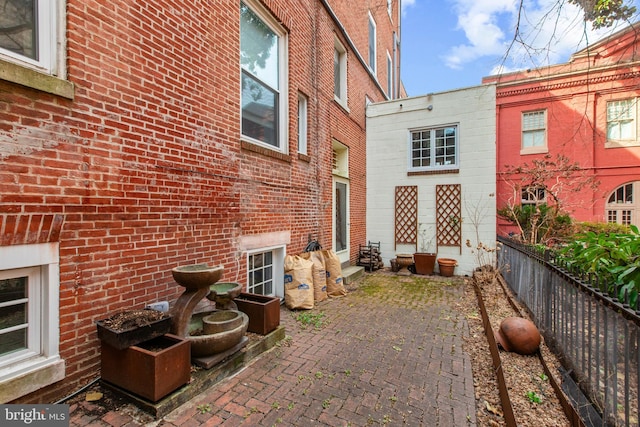 view of patio / terrace featuring fence