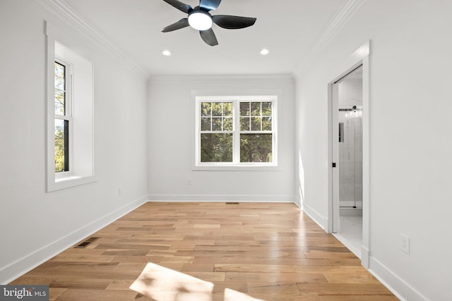 unfurnished bedroom with crown molding, baseboards, visible vents, and light wood finished floors