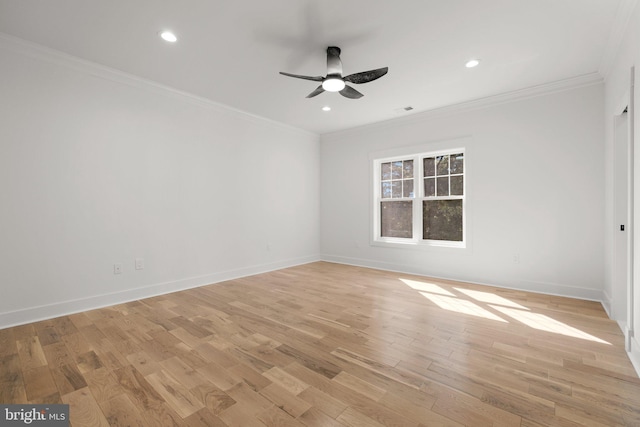 empty room featuring recessed lighting, crown molding, light wood-type flooring, and baseboards