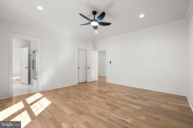 unfurnished bedroom with light wood-type flooring, baseboards, and ornamental molding