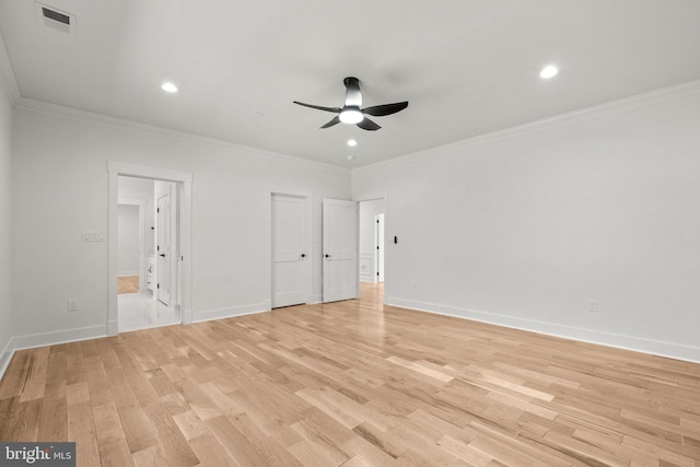 unfurnished bedroom featuring baseboards, light wood finished floors, and ornamental molding