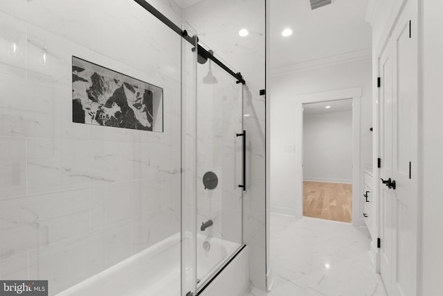 bathroom featuring visible vents, marble finish floor, ornamental molding, shower / bath combination with glass door, and baseboards