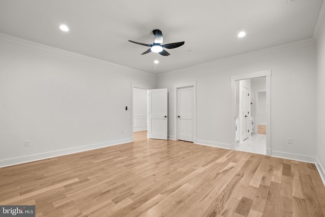 unfurnished bedroom featuring baseboards, light wood-style floors, and crown molding