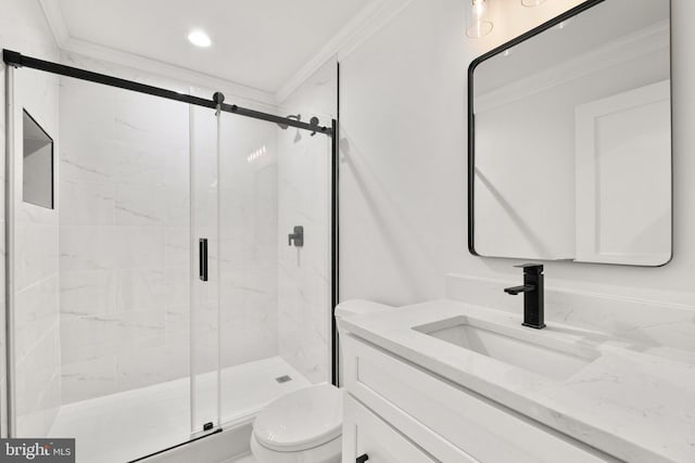 bathroom with a marble finish shower, vanity, toilet, and crown molding