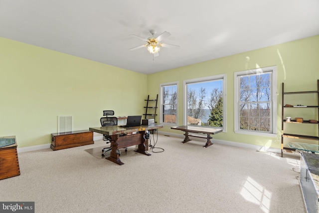 home office with visible vents, baseboards, ceiling fan, and carpet floors