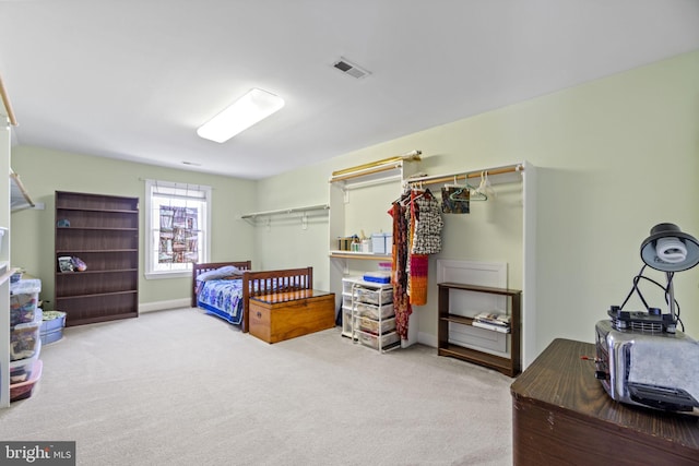 carpeted bedroom with visible vents