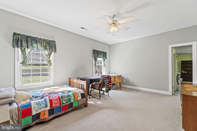 bedroom featuring carpet flooring, baseboards, visible vents, and ceiling fan