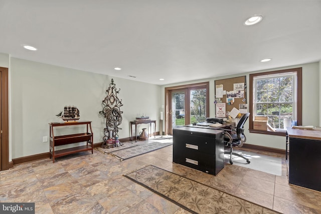 home office featuring recessed lighting, a healthy amount of sunlight, and baseboards